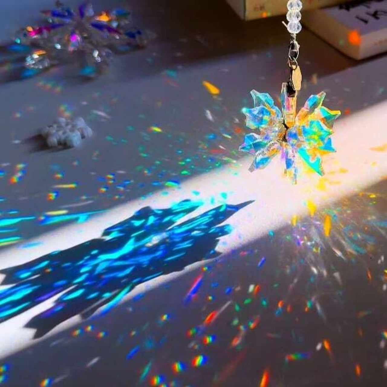 Lightbloom Snow variation crystal suncatcher by Sashura, clear natural stone window prism