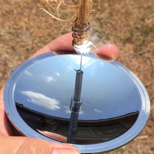 Igniflare™ Parabolic Solar Fire Starter compact size held in hand showing lightweight portable design by Sashura
