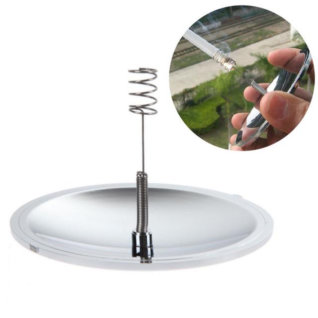 Igniflare™ Solar Fire Starter igniting tinder with concentrated sunlight beam outdoor survival demonstration