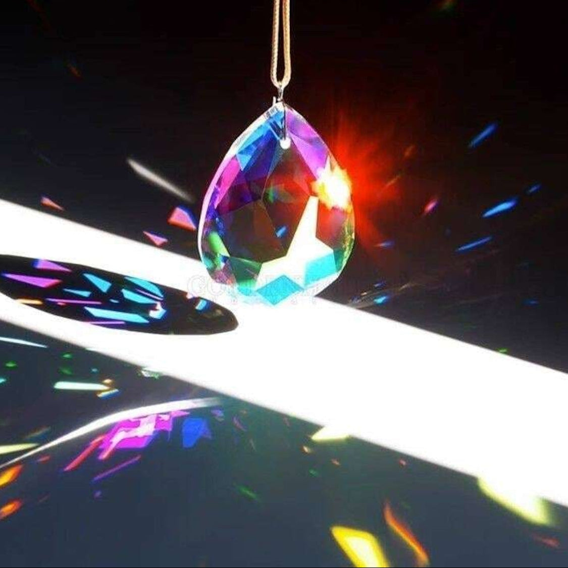 Lightbloom Teardrop crystal suncatcher by Sashura, elegant window prism catching sunlight
