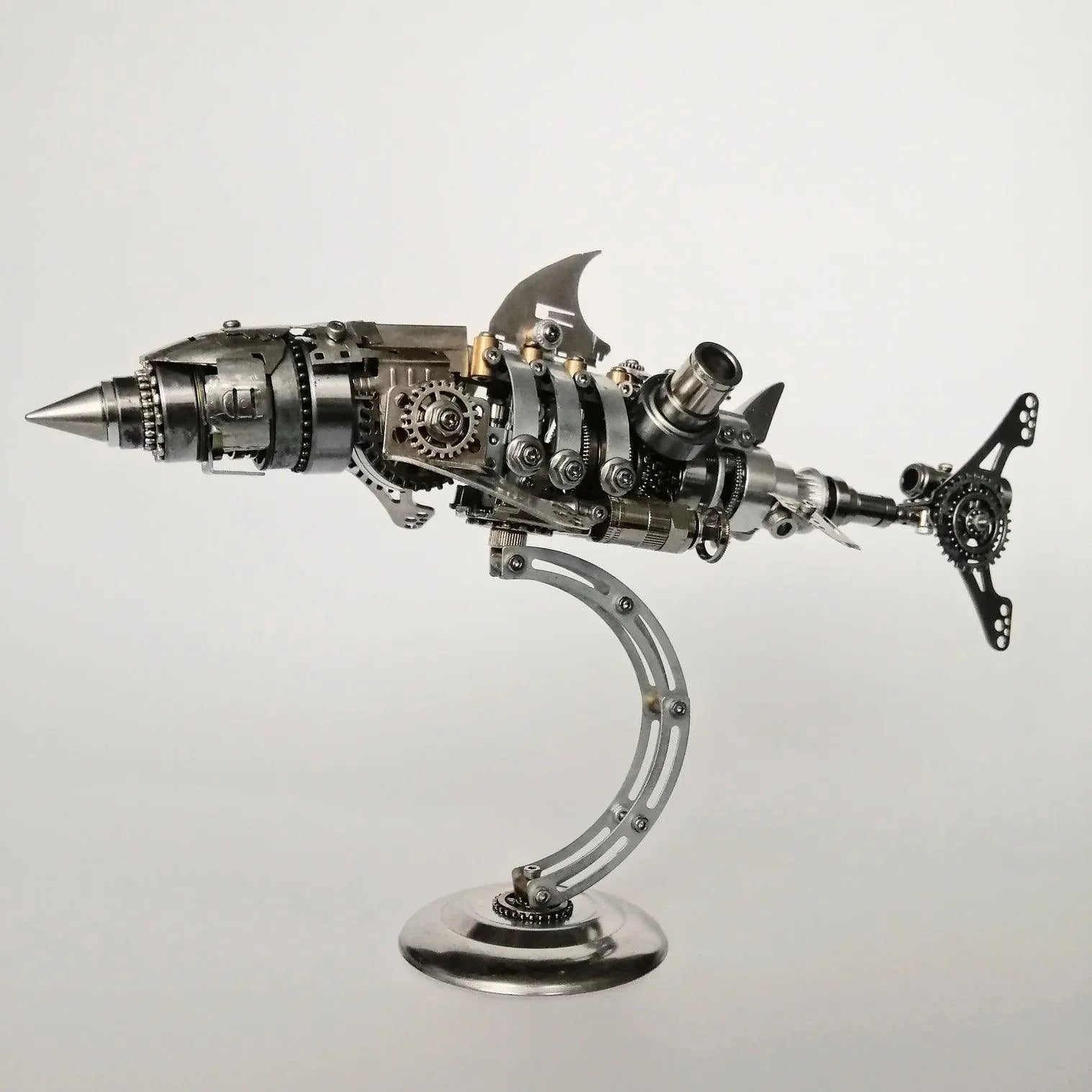 https://cdn.shopify.com/s/files/1/0743/8945/5069/files/puzzloria-3d-metal-puzzle-display-support-puzzloria-diy-3d-metal-mechanical-shark-puzzle-model-assembly-kit-209pcs-main.webp?v=1747694332