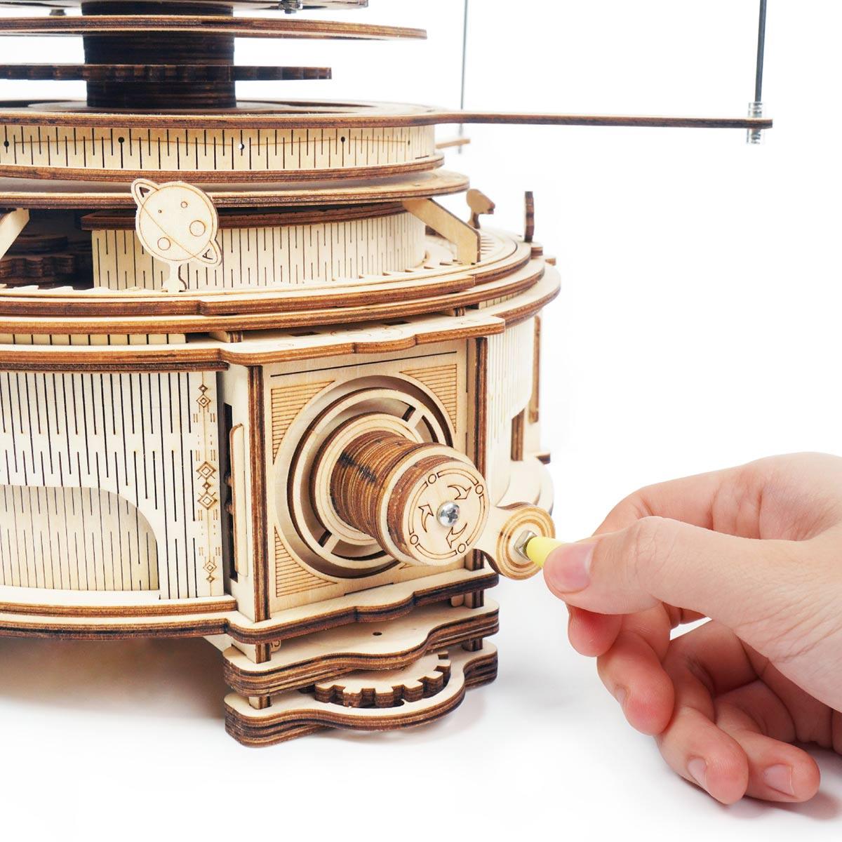 https://cdn.shopify.com/s/files/1/0743/8945/5069/files/puzzloria-3d-wooden-puzzle-deluxe-wooden-orbital-puzzloria-celestial-explorer-mechanical-orrery-43347851378909.jpg?v=1745185573