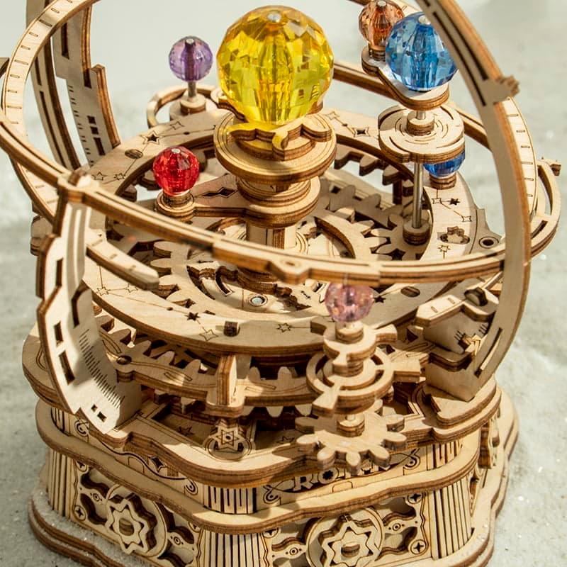 https://cdn.shopify.com/s/files/1/0743/8945/5069/files/puzzloria-3d-wooden-puzzle-deluxe-wooden-orbital-puzzloria-celestial-explorer-mechanical-orrery-43787209769181.jpg?v=1745185844