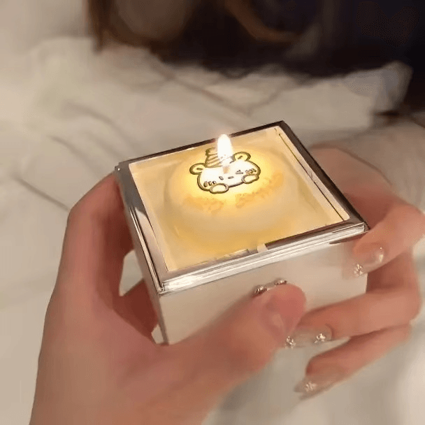 https://cdn.shopify.com/s/files/1/0743/8945/5069/files/puzzloria-anti-stress-toy-default-title-puzzloria-enchanted-moments-bear-candle-ring-box-43585949466845.png?v=1745244577
