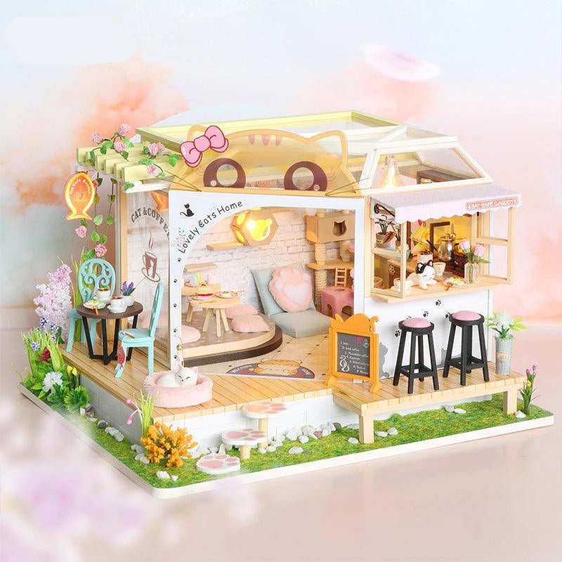 https://cdn.shopify.com/s/files/1/0743/8945/5069/files/puzzloria-diy-miniature-default-title-puzzloria-diy-dollhouse-kit-cat-coffee-garden-43347874054365.jpg?v=1745185952