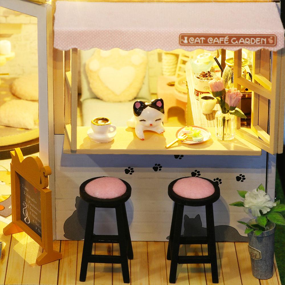 https://cdn.shopify.com/s/files/1/0743/8945/5069/files/puzzloria-diy-miniature-default-title-puzzloria-diy-dollhouse-kit-cat-coffee-garden-43347874119901.jpg?v=1745185725