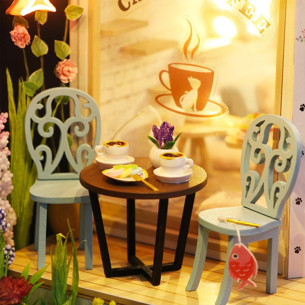 https://cdn.shopify.com/s/files/1/0743/8945/5069/files/puzzloria-diy-miniature-default-title-puzzloria-diy-dollhouse-kit-cat-coffee-garden-43347874185437.jpg?v=1745185955