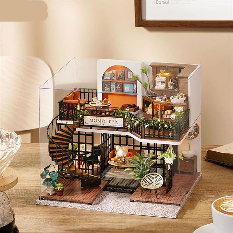 https://cdn.shopify.com/s/files/1/0743/8945/5069/files/puzzloria-diy-miniature-default-title-puzzloria-diy-dollhouse-kit-forest-teashop-43347885457629.jpg?v=1745185876
