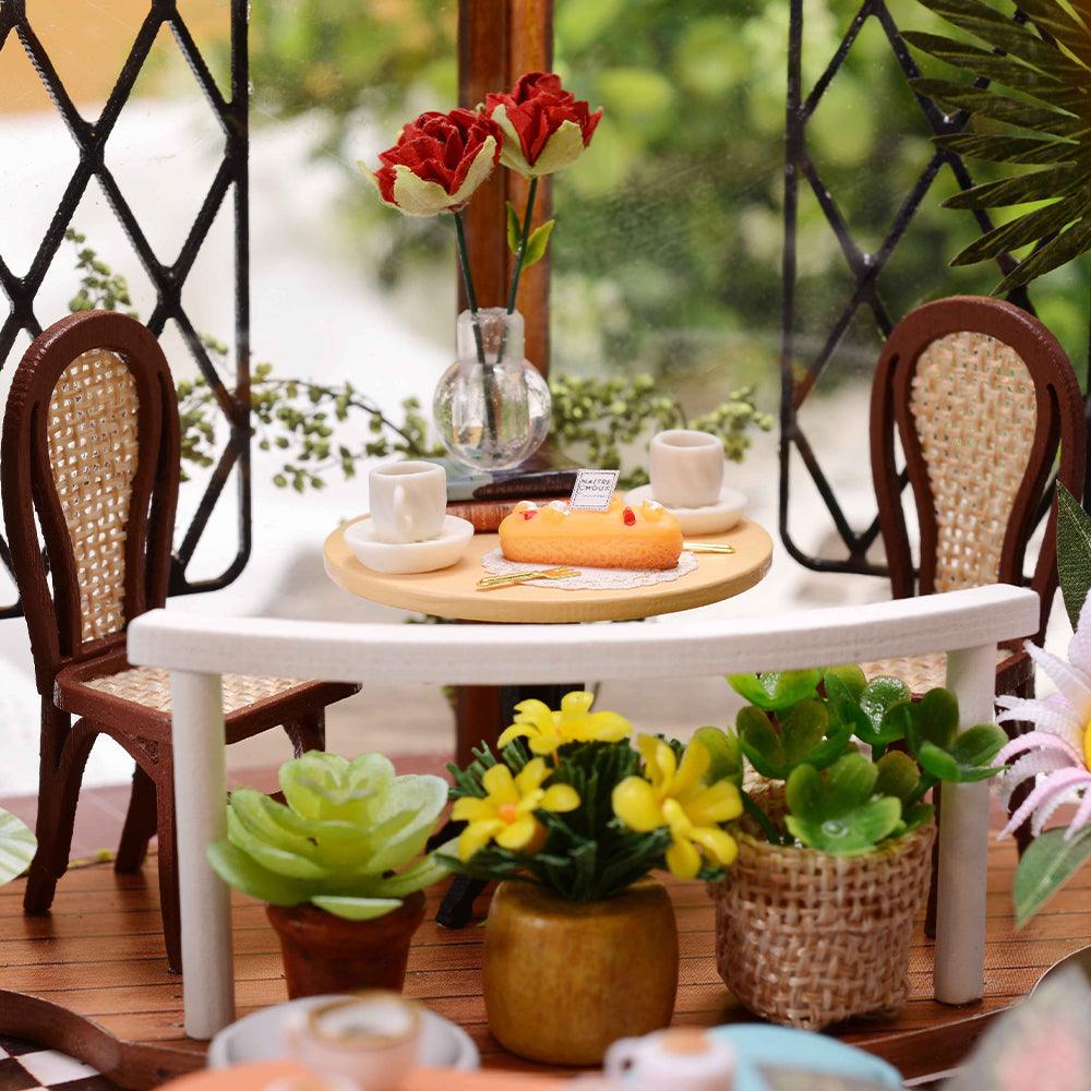 https://cdn.shopify.com/s/files/1/0743/8945/5069/files/puzzloria-diy-miniature-default-title-puzzloria-diy-dollhouse-kit-garden-cafe-43347898499293.jpg?v=1749504145