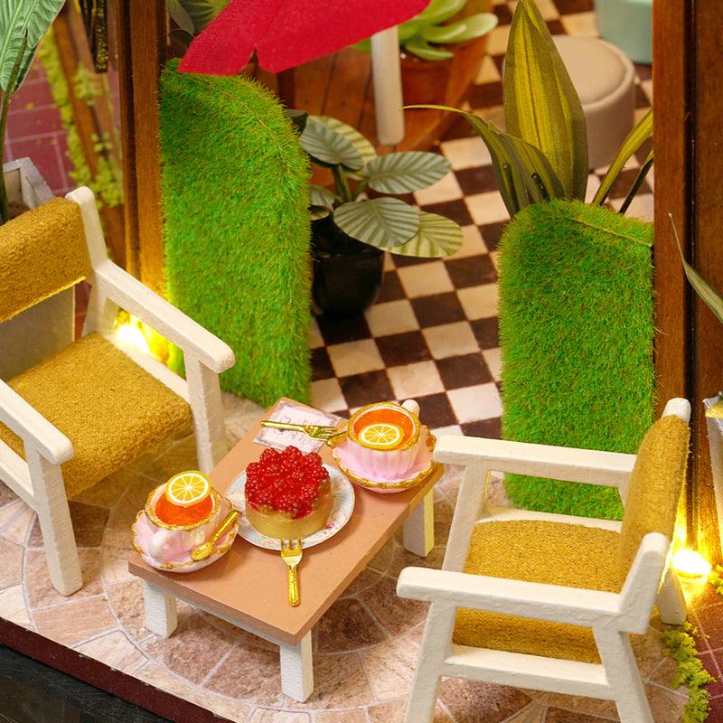 https://cdn.shopify.com/s/files/1/0743/8945/5069/files/puzzloria-diy-miniature-default-title-puzzloria-diy-dollhouse-kit-garden-cafe-43347898564829.jpg?v=1749504145