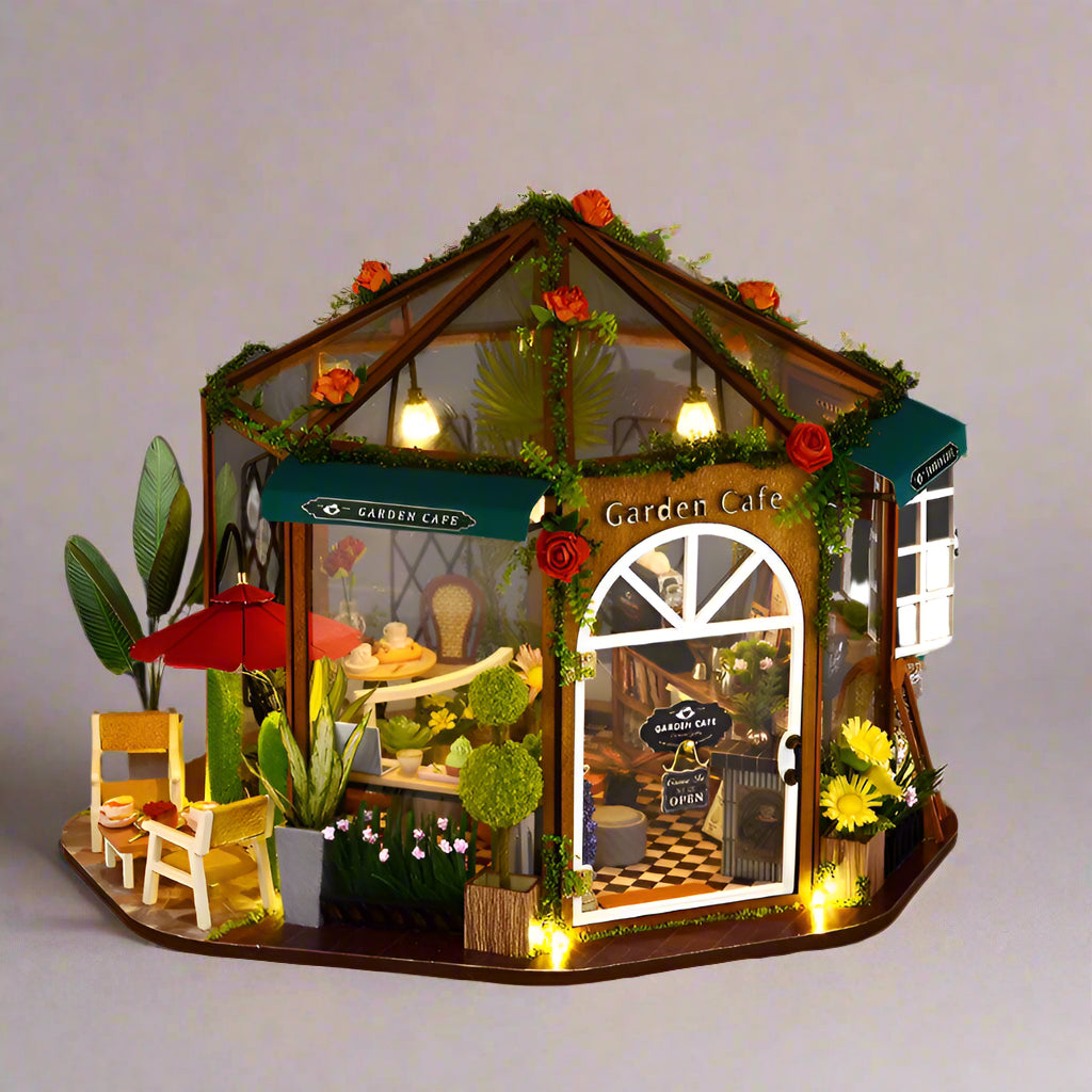 https://cdn.shopify.com/s/files/1/0743/8945/5069/files/puzzloria-diy-miniature-default-title-puzzloria-diy-dollhouse-kit-garden-cafe-43347898630365.jpg?v=1749504145