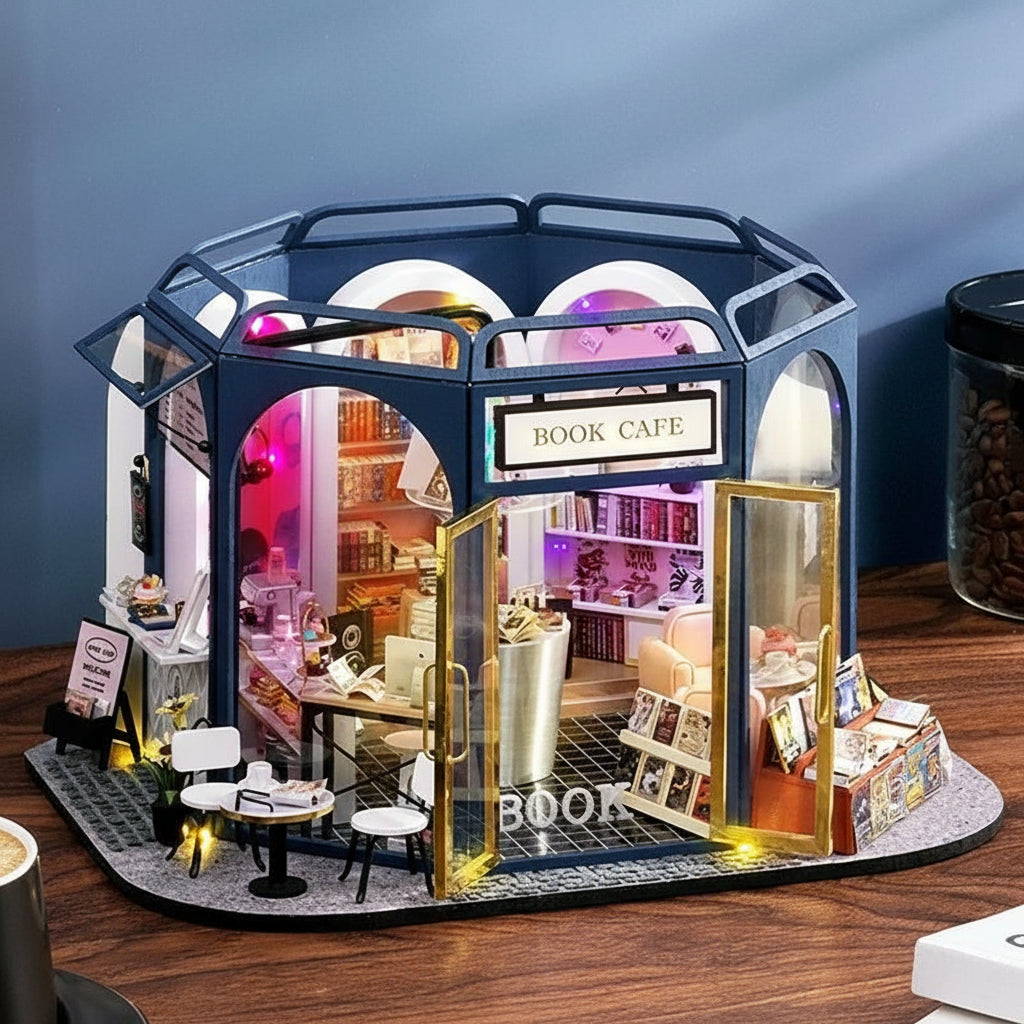 https://cdn.shopify.com/s/files/1/0743/8945/5069/files/puzzloria-diy-miniature-default-title-puzzloria-dollhouse-kit-book-cafe-43347875692765.jpg?v=1764461140