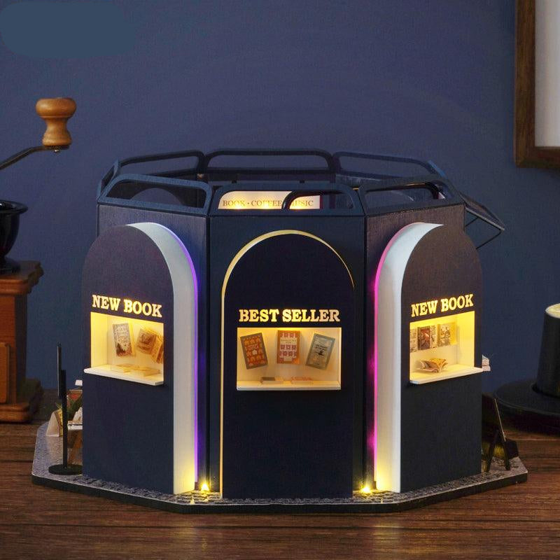 https://cdn.shopify.com/s/files/1/0743/8945/5069/files/puzzloria-diy-miniature-default-title-puzzloria-dollhouse-kit-book-cafe-43347875758301.jpg?v=1745185882