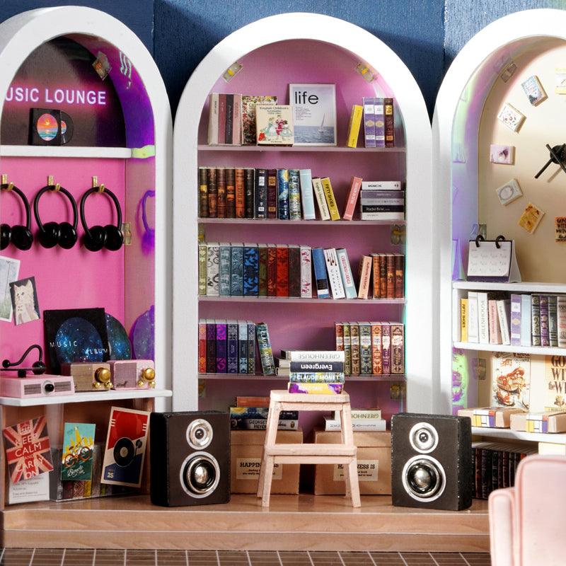 https://cdn.shopify.com/s/files/1/0743/8945/5069/files/puzzloria-diy-miniature-default-title-puzzloria-dollhouse-kit-book-cafe-43347875856605.jpg?v=1745185972