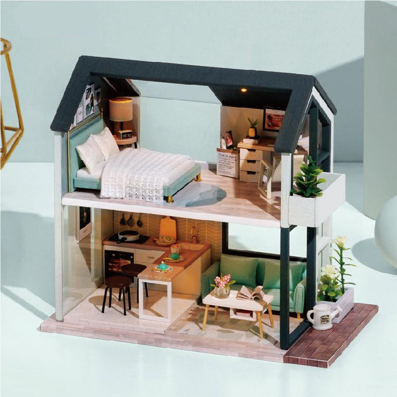 https://cdn.shopify.com/s/files/1/0743/8945/5069/files/puzzloria-diy-miniature-green-puzzloria-diy-dollhouse-kit-apartment-43347922157789.jpg?v=1745186017