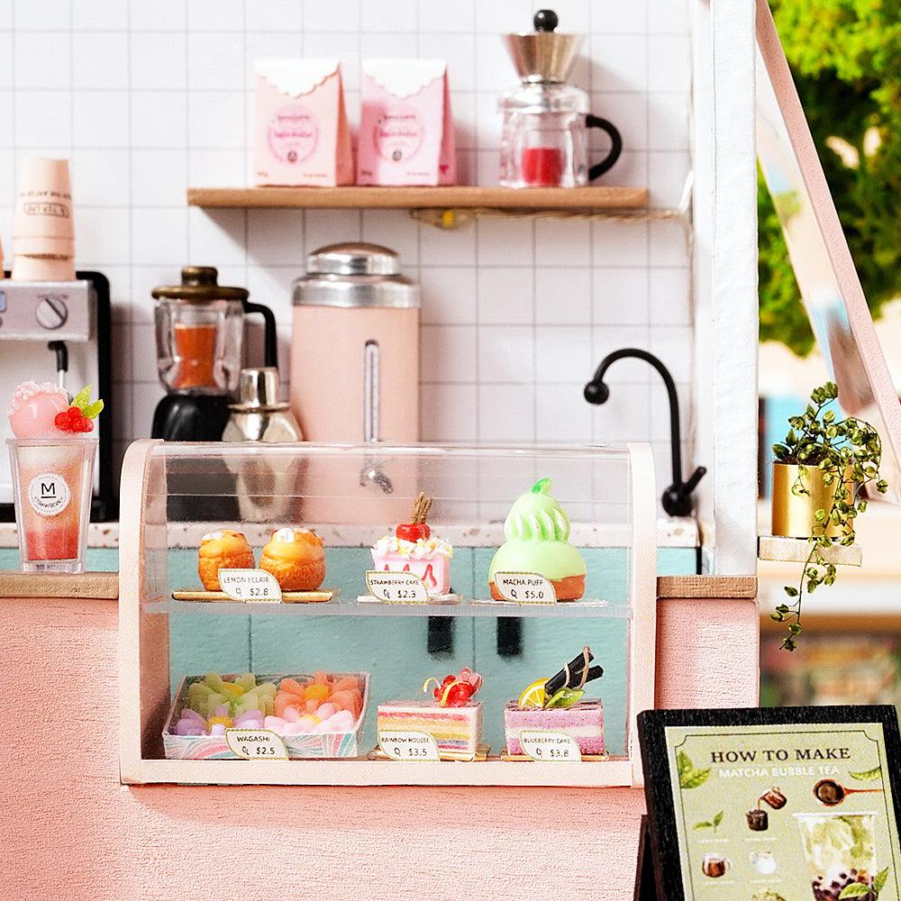 https://cdn.shopify.com/s/files/1/0743/8945/5069/files/puzzloria-diy-miniature-pink-puzzloria-diy-dollhouse-kit-happy-shop-series-43347879297245.jpg?v=1747661640