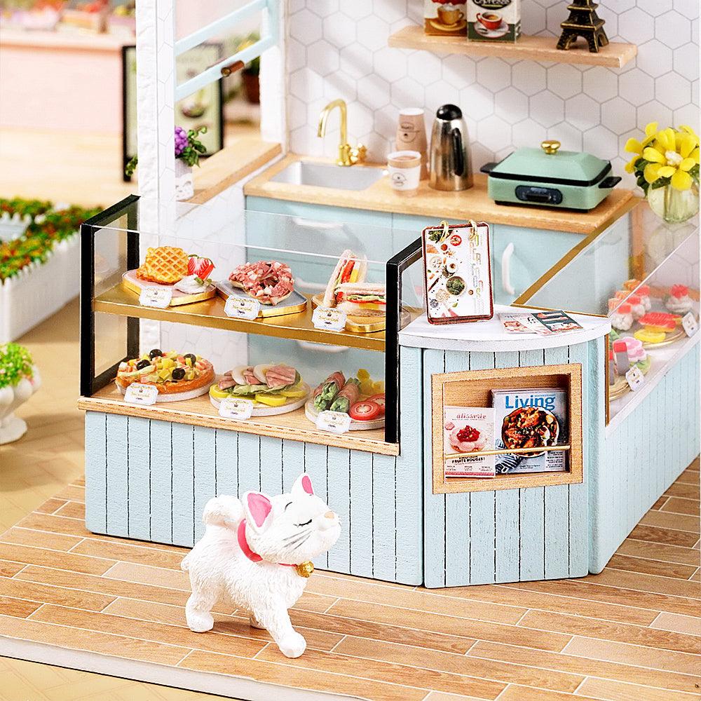 https://cdn.shopify.com/s/files/1/0743/8945/5069/files/puzzloria-diy-miniature-pink-puzzloria-diy-dollhouse-kit-happy-shop-series-43347879428317.jpg?v=1747661640