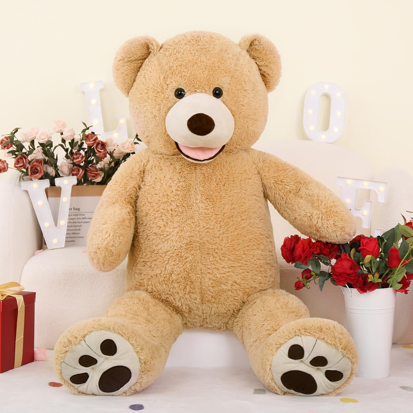 https://cdn.shopify.com/s/files/1/0743/8945/5069/files/puzzloria-giant-teddy-bear-4-feet-big-footprints-plush-stuffed-animals-brown-2.jpg?v=1760047296