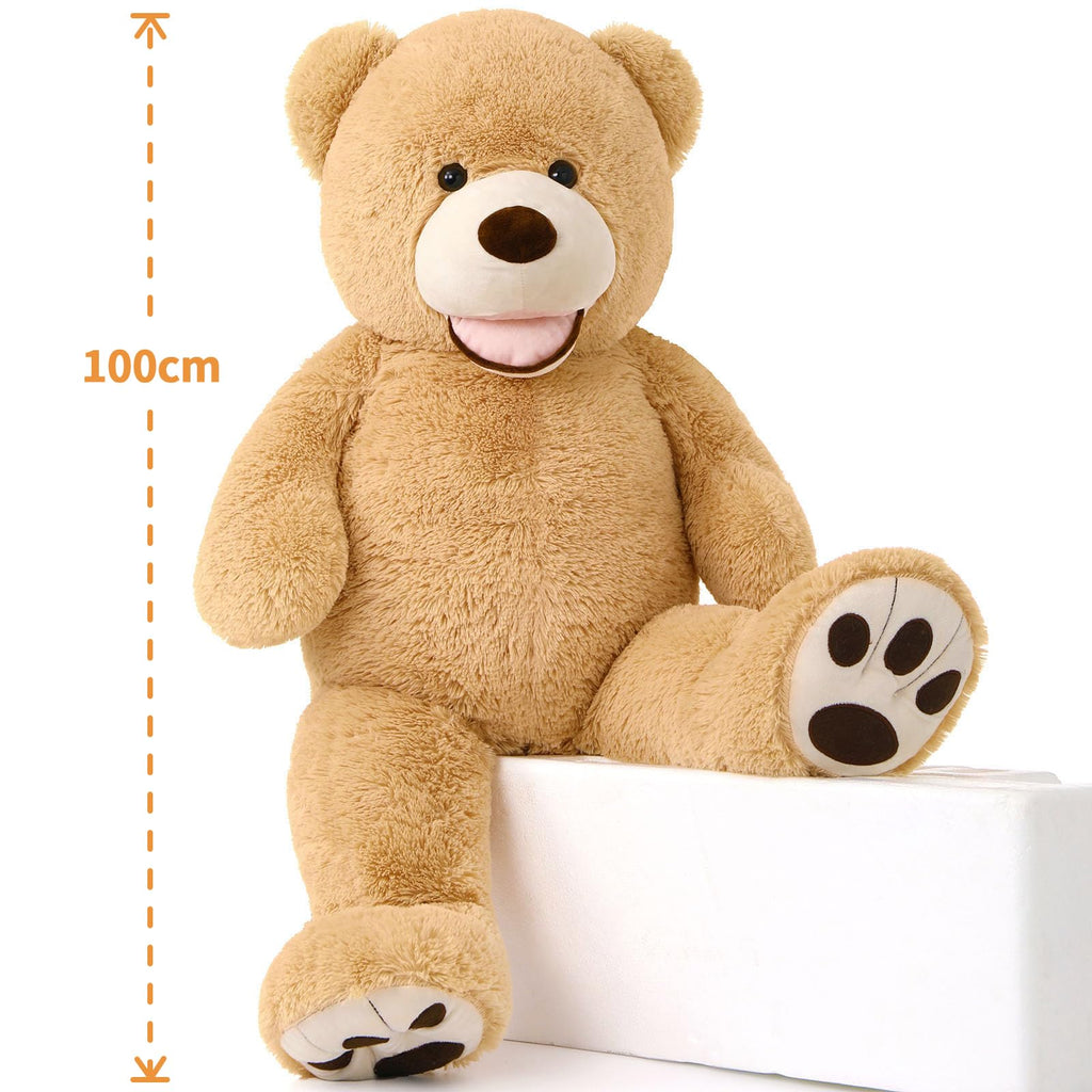 https://cdn.shopify.com/s/files/1/0743/8945/5069/files/puzzloria-giant-teddy-bear-4-feet-big-footprints-plush-stuffed-animals-brown-dims.jpg?v=1760047296