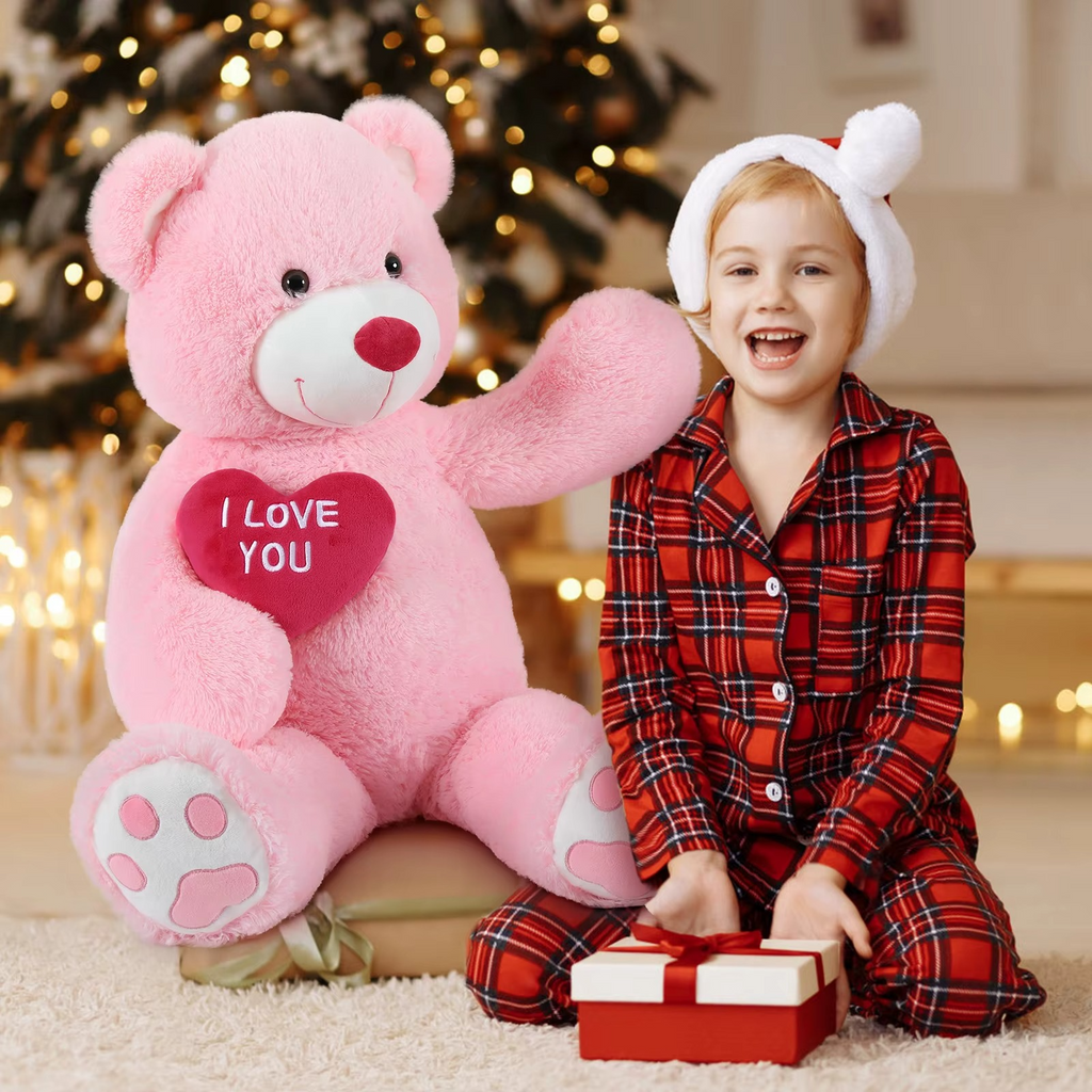 https://cdn.shopify.com/s/files/1/0743/8945/5069/files/puzzloria-giant-teddy-bear-4-feet-big-footprints-plush-stuffed-animals-pink-2.png?v=1765218441