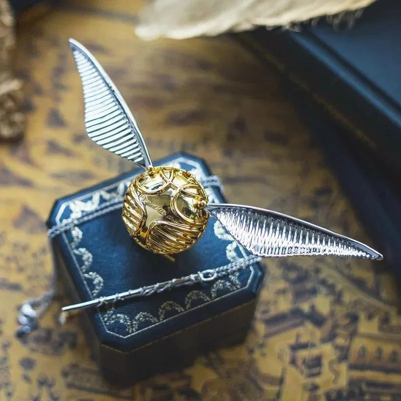https://cdn.shopify.com/s/files/1/0743/8945/5069/files/puzzloria-golden-snitch-ring-box-cheap.jpg?v=1765193848