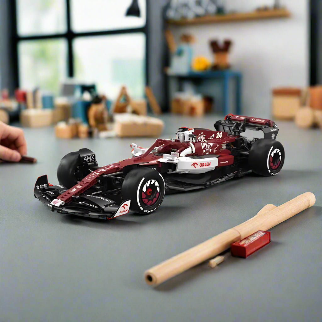 https://cdn.shopify.com/s/files/1/0743/8945/5069/files/puzzloria-lego-default-title-puzzloria-technical-f1-c42-racing-builder-43569489608925.jpg?v=1754489923