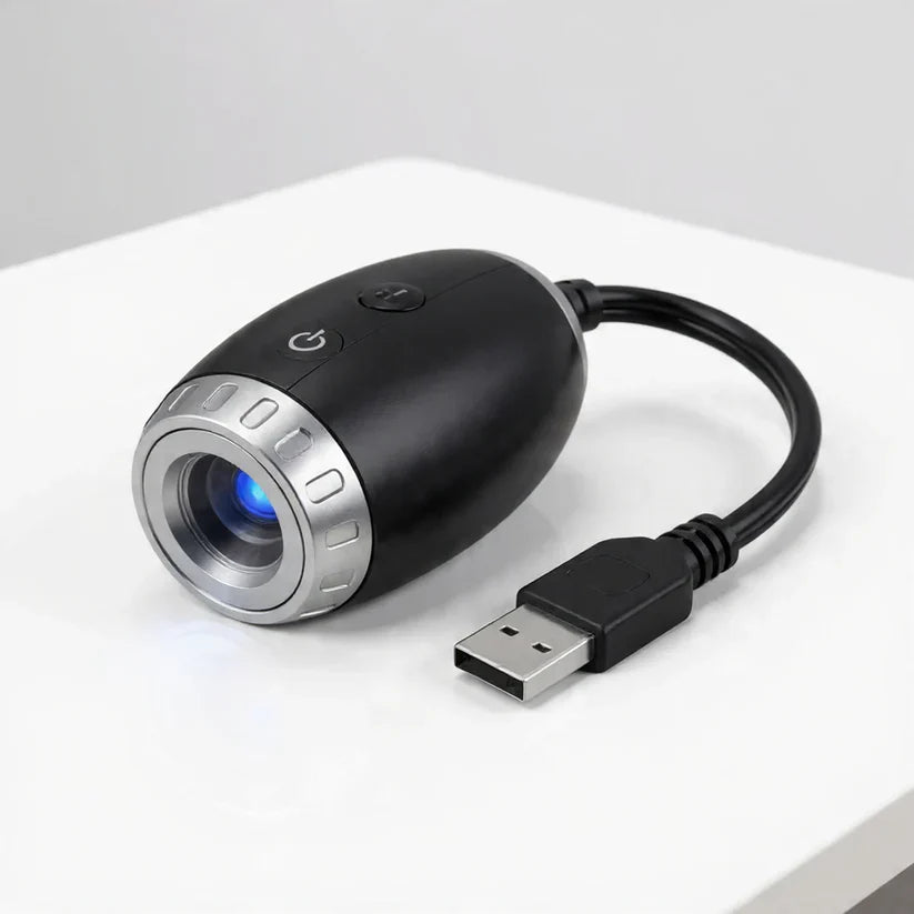 StarVeil AuraDrift Light matte black body with USB cable on white background, compact dreamy star ceiling light design